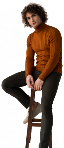 men fashion model with curly hair sitting in chair posing for a photo